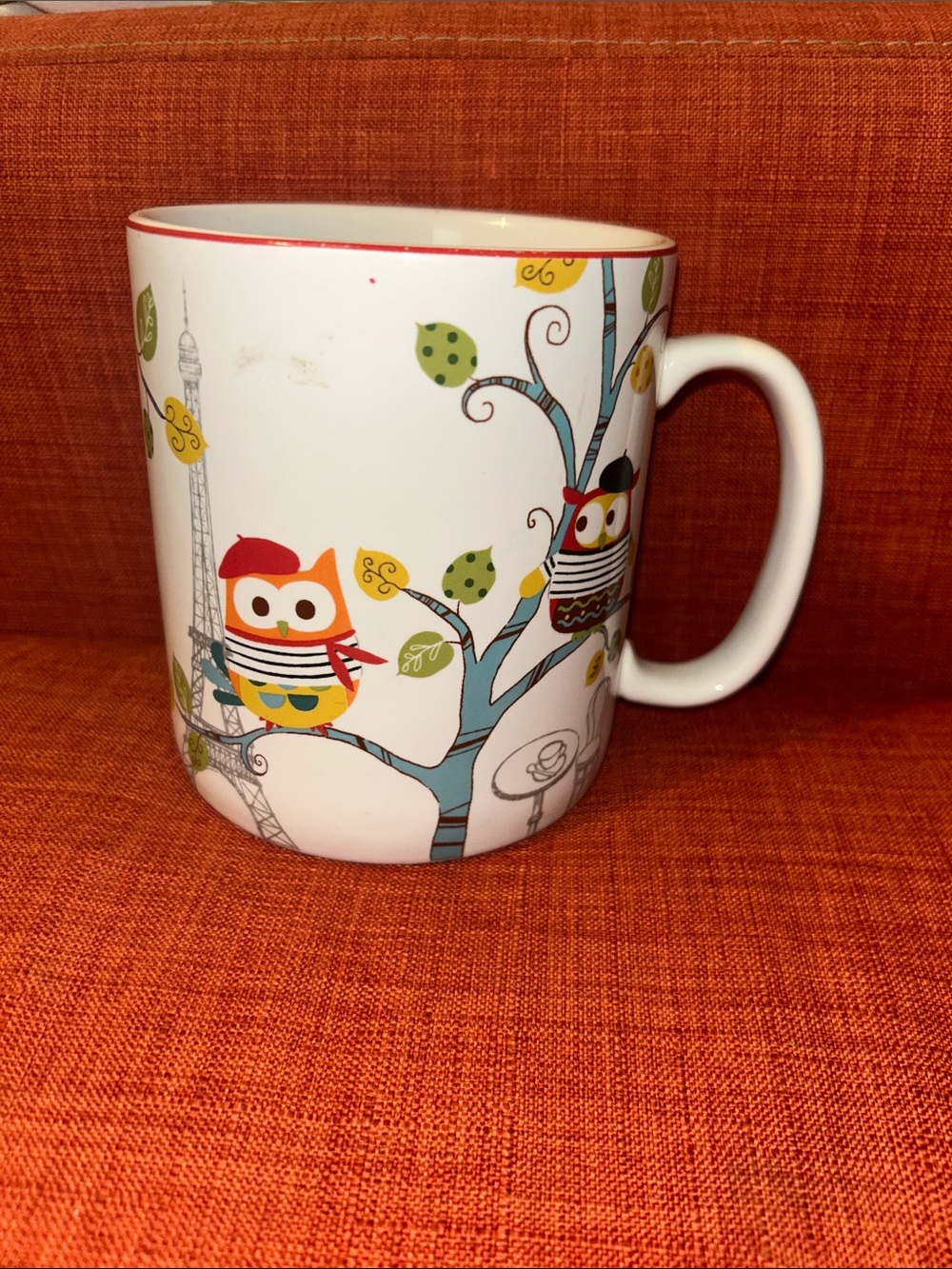 222 Fifth Owl Ceramic Mug in White with Orange, Blue and Green Accents